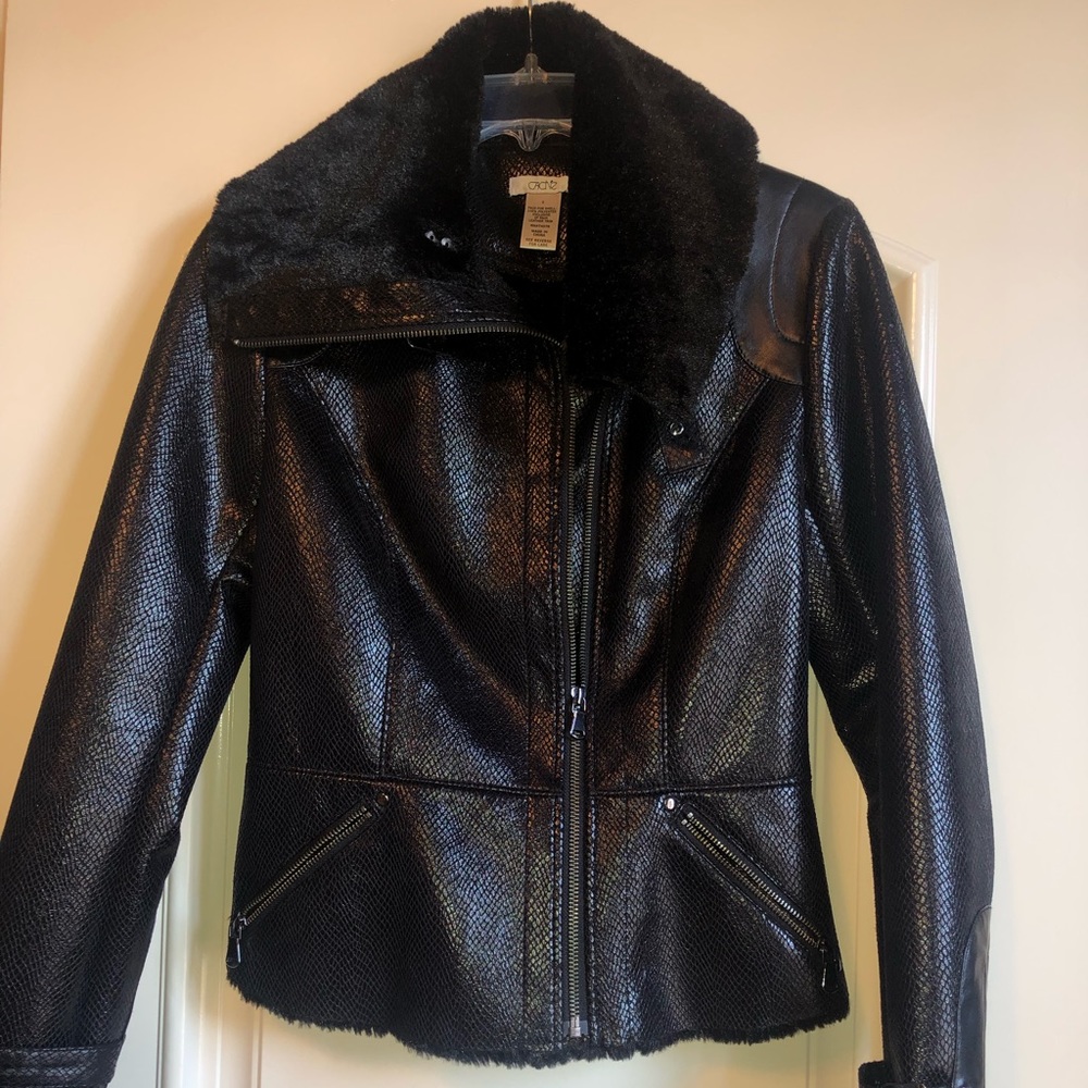 Faux leather with faux fur trim and inside